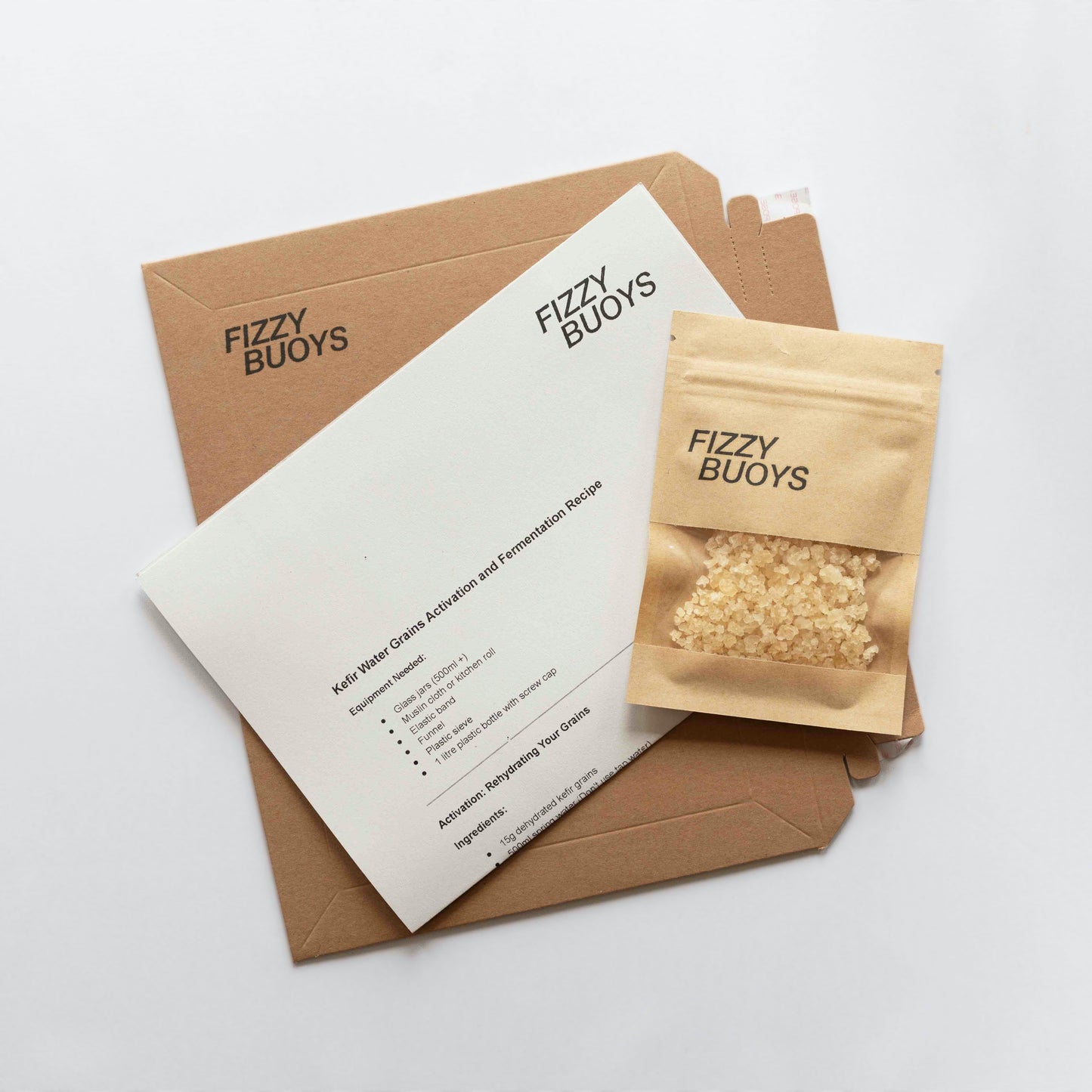 Fizzy Buoys packaging with a brown envelope and instructions on a white background
